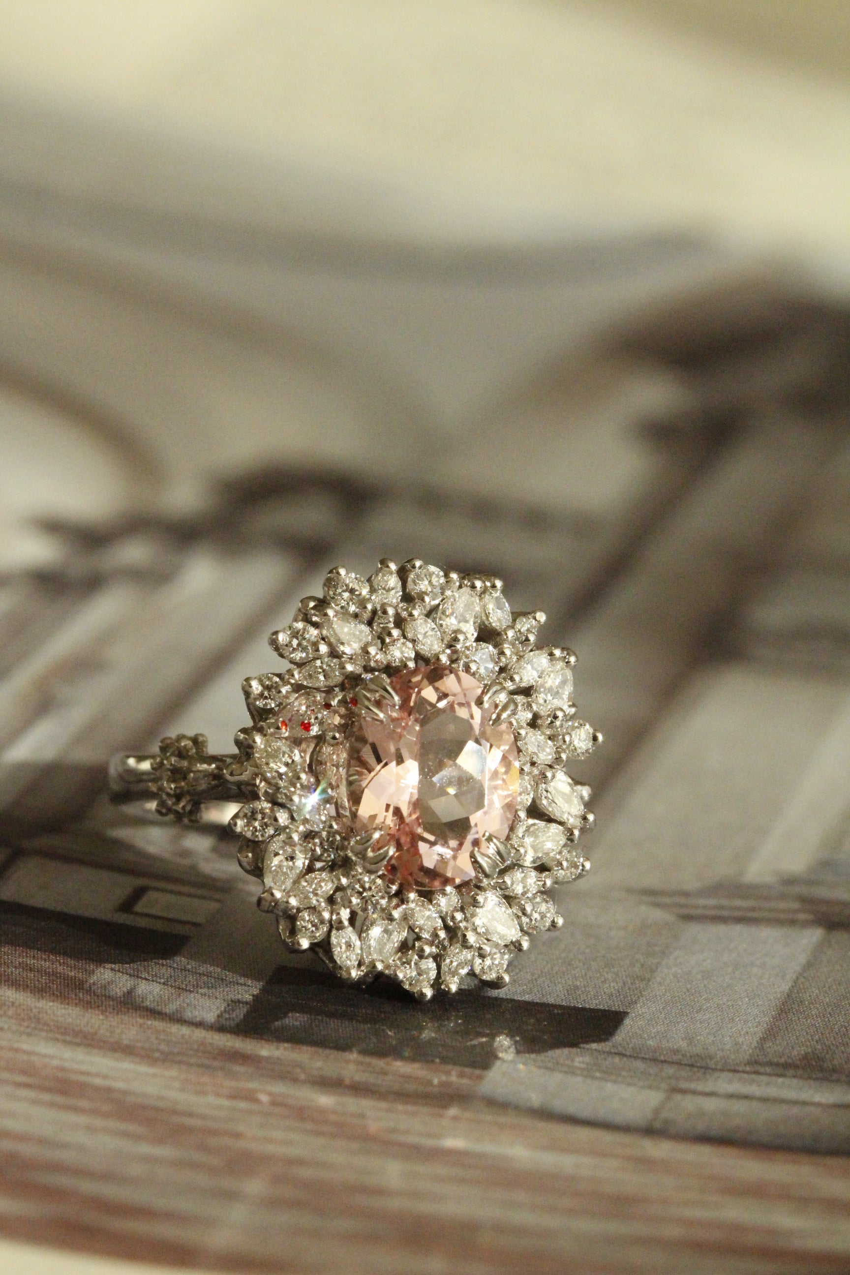 Fine jewellery custom ring with pear diamond and marquise diamonds with morganite gemstone