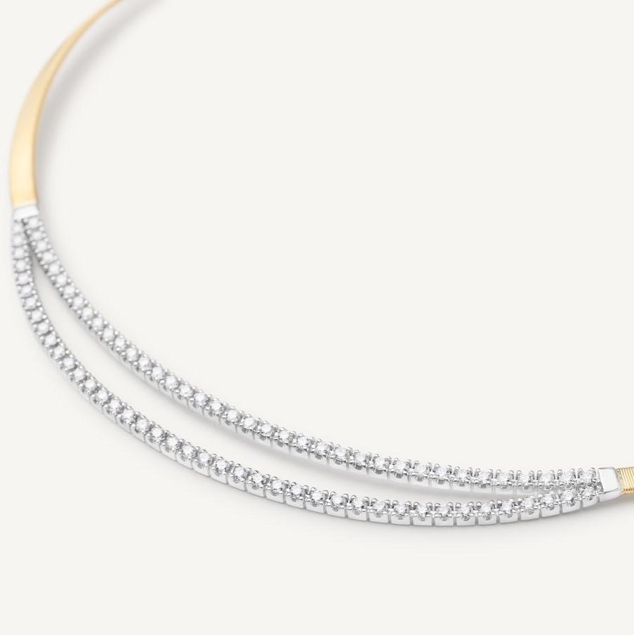 A single 18K yellow gold coil strand, carefully created with the brand’s exclusive coil technique and embellished with two brilliant-cut diamond bars.